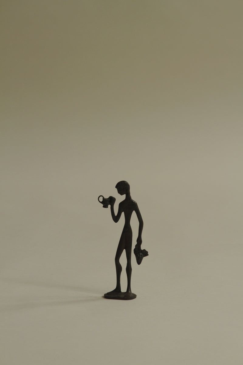 Figurine of Man Drinking